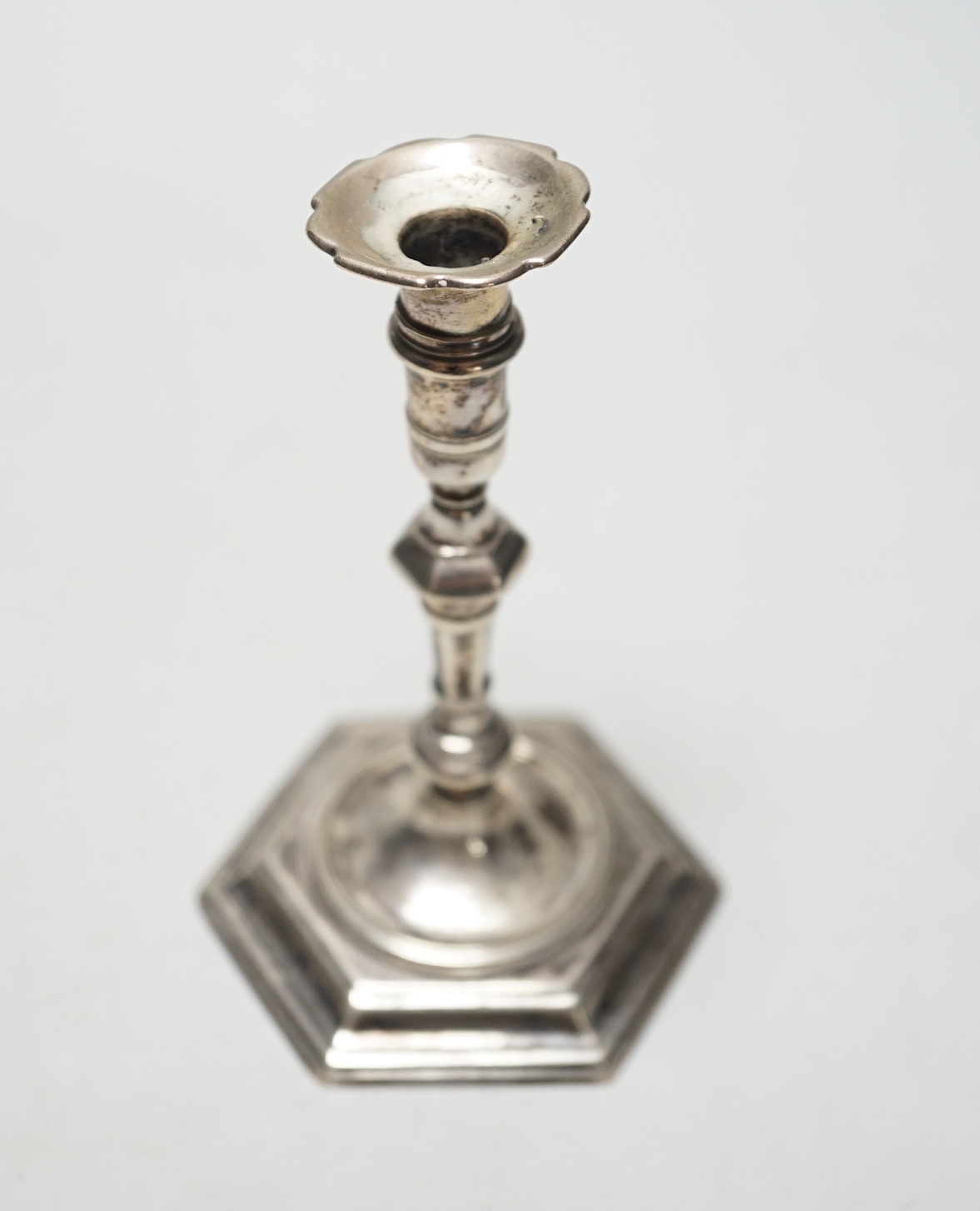 A George II cast silver taper stick, James Gould, London, 1732, 10.8cm, 3oz, with later? unmarked sconce.